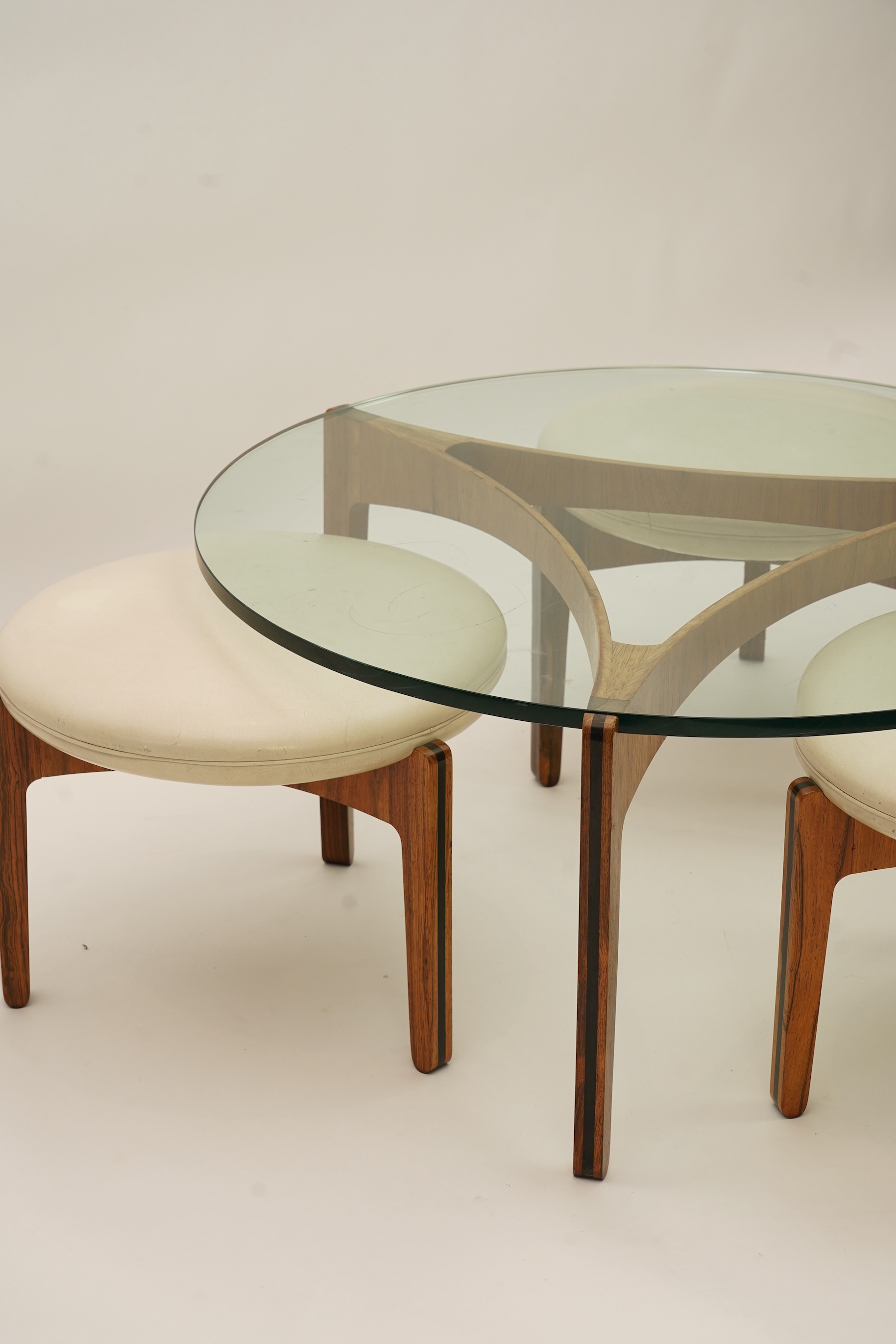 Sven Ellekaer (Danish, 1926-1984) for Christian Linneberg Møbelfabrik: A coffee table and three nesting stools ensuite